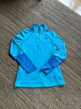 The North Face Bright Turquoise 1/4 Zip Pullover with Deep Blue Sleeve Panels